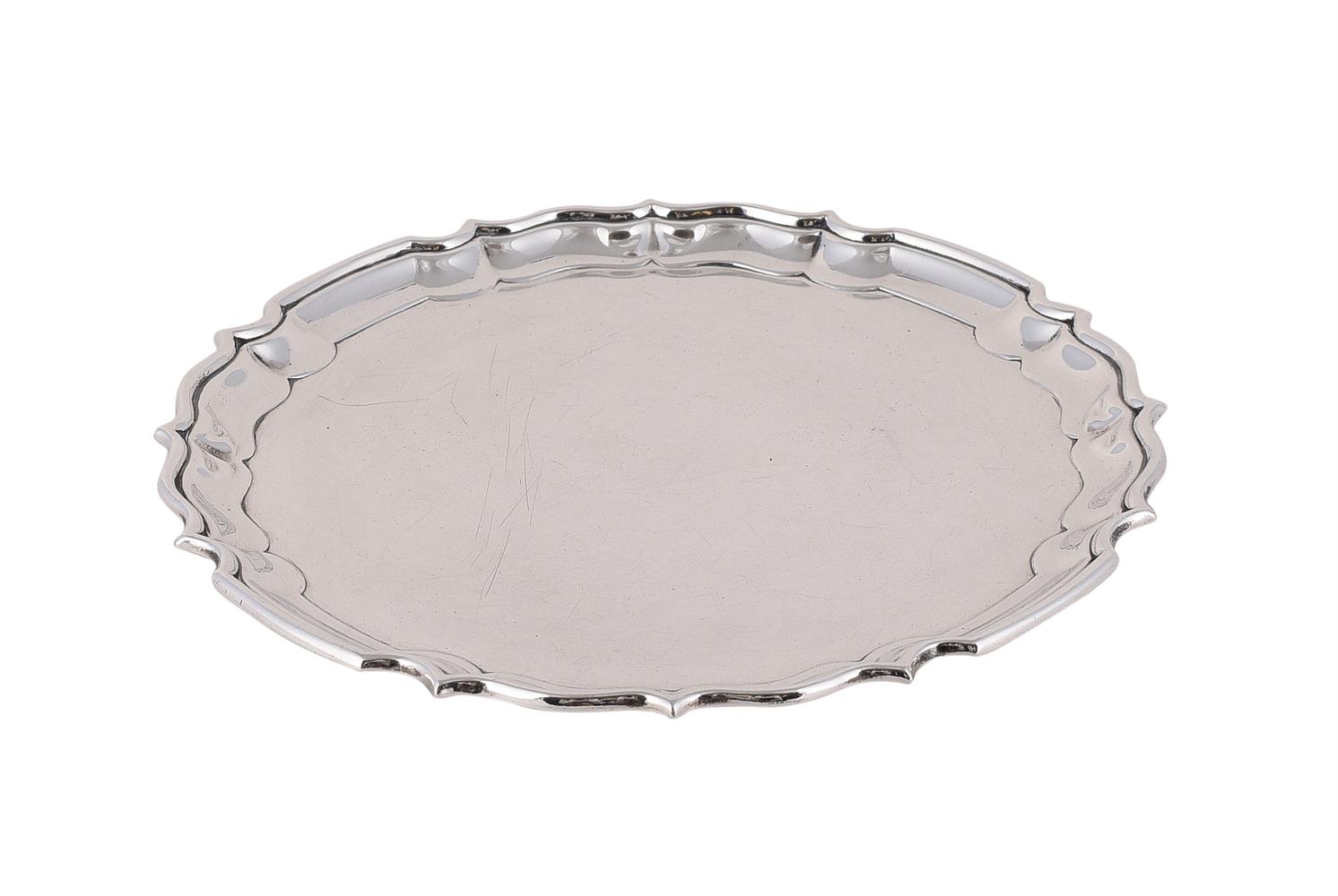 A SILVER SHAPED CIRCULAR SALVER