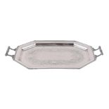 A SILVER OCTAGONAL TWIN HANDLED TRAY