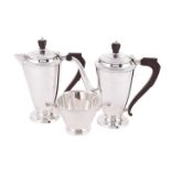 A SILVER THREE PIECE TAPERING TEA SET