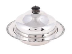 A SILVER MUFFIN DISH AND COVER