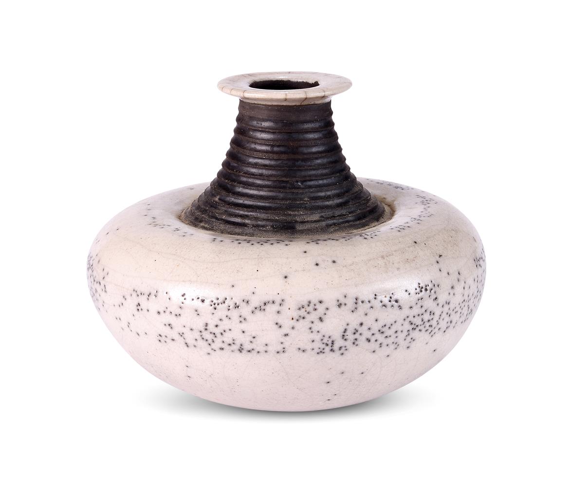 JO FIRTH (b. 1955) A STUDIO POTTERY ROKU FIRED BOTTLE VASE OF COMPRESSED GLOBULAR FORM