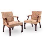 A PAIR OF GEORGE III STYLE MAHOGANY LIBRARY ARMCHAIRS