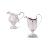 A GEORGE III SILVER HELMET SHAPED CREAM JUG