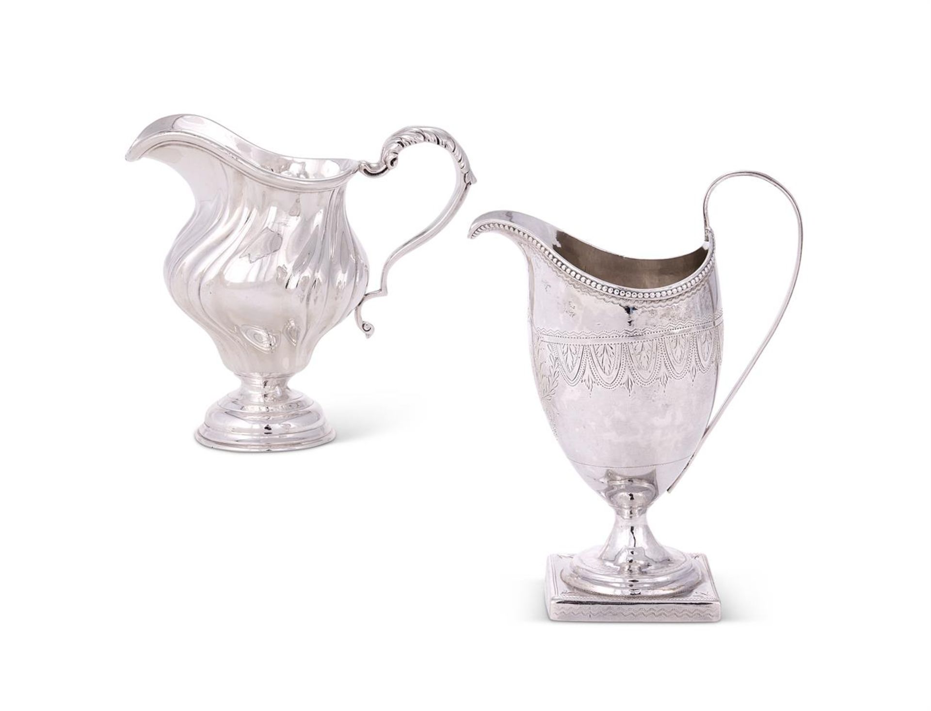 A GEORGE III SILVER HELMET SHAPED CREAM JUG