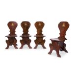 A SET OF FOUR GEORGE II OAK `SGABELLO' HALL CHAIRS MID-18TH CENTURY