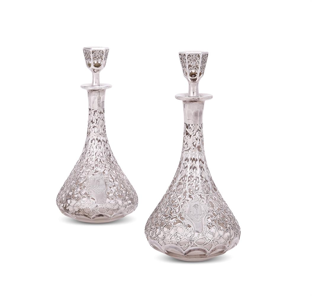 A PAIR OF SILVER-MOUNTED GLASS DECANTERS