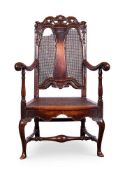 A QUEEN ANNE WALNUT OPEN ARMCHAIR CIRCA 1710