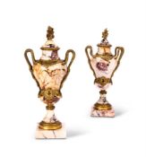 A PAIR OF GILT METAL MOUNTED BRÈCHE VIOLETTE URNS EARLY 20TH CENTURY