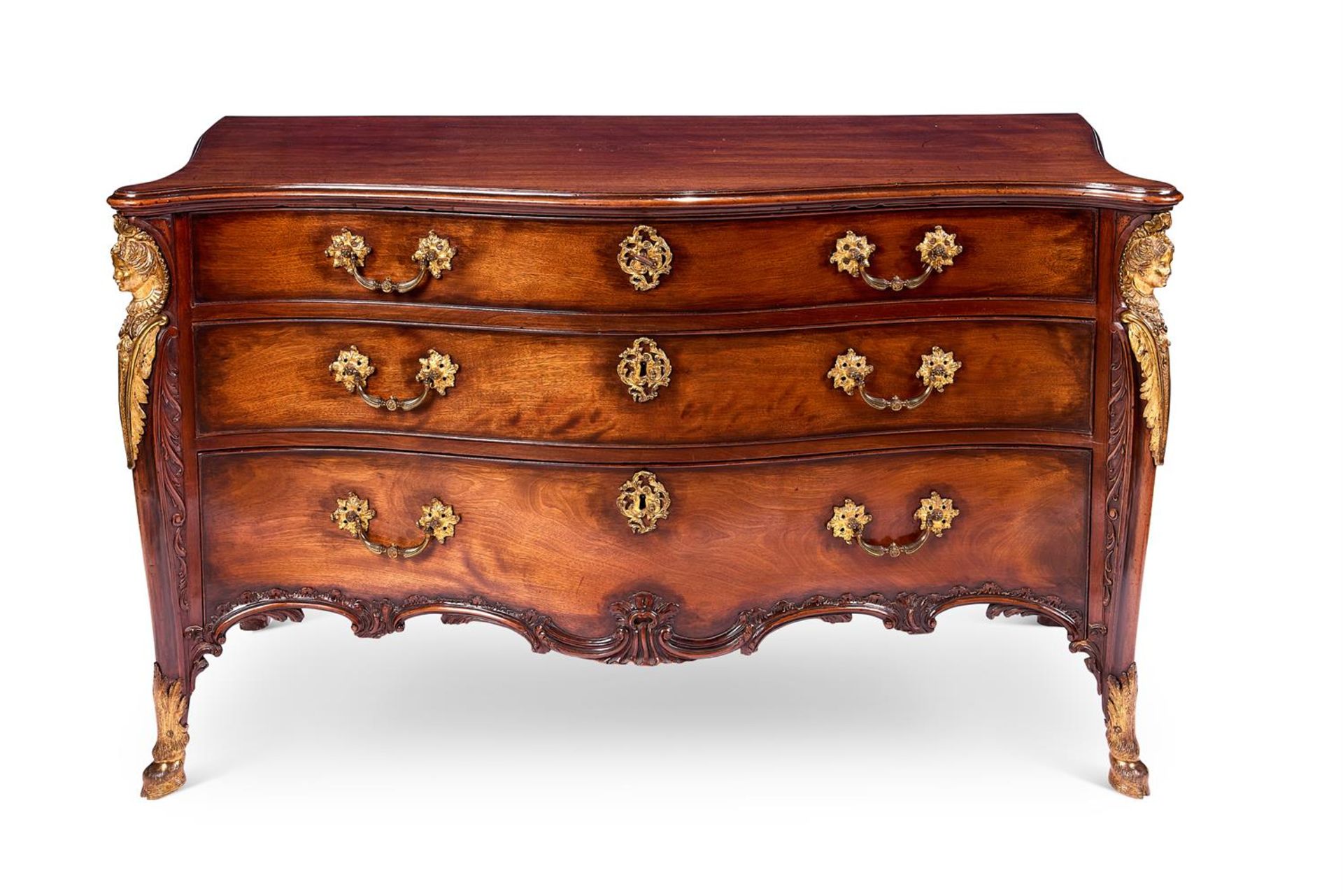 A GEORGE III ORMOLU-MOUNTED MAHOGANY SERPENTINE COMMODE