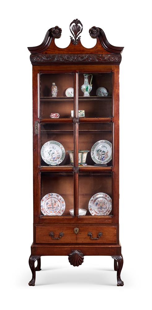 A MAHOGANY DISPLAY CABINET OF IRISH GEORGE III STYLE18TH CENTURY AND LATERThe scrolled pediment ca