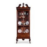 A MAHOGANY DISPLAY CABINET OF IRISH GEORGE III STYLE18TH CENTURY AND LATERThe scrolled pediment ca