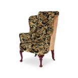 A WALNUT AND FLORAL TAPESTRY UPHOLSTERED WING ARMCHAIR OF GEORGE I STYLE