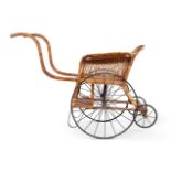 A LATE VICTORIAN WICKER PUSH CHAIR CIRCA 1900