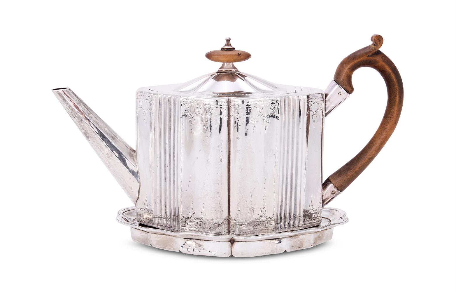 A GEORGE III SILVER SHAPED OVAL TEA POT AND STAND
