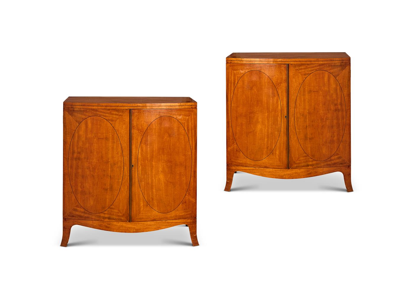 Y A PAIR OF EDWARDIAN SATINWOOD AND EBONY-LINE INLAID BOWFRONT SIDE CABINETS EARLY 20TH CENTURY