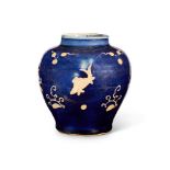 A CHINESE BLUE-GROUND 'FISH' JAR, MING DYNASTY