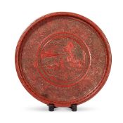 A CHINESE CIRCULAR CINNABAR LACQUER DISH, QING DYNASTY (1644-1911)