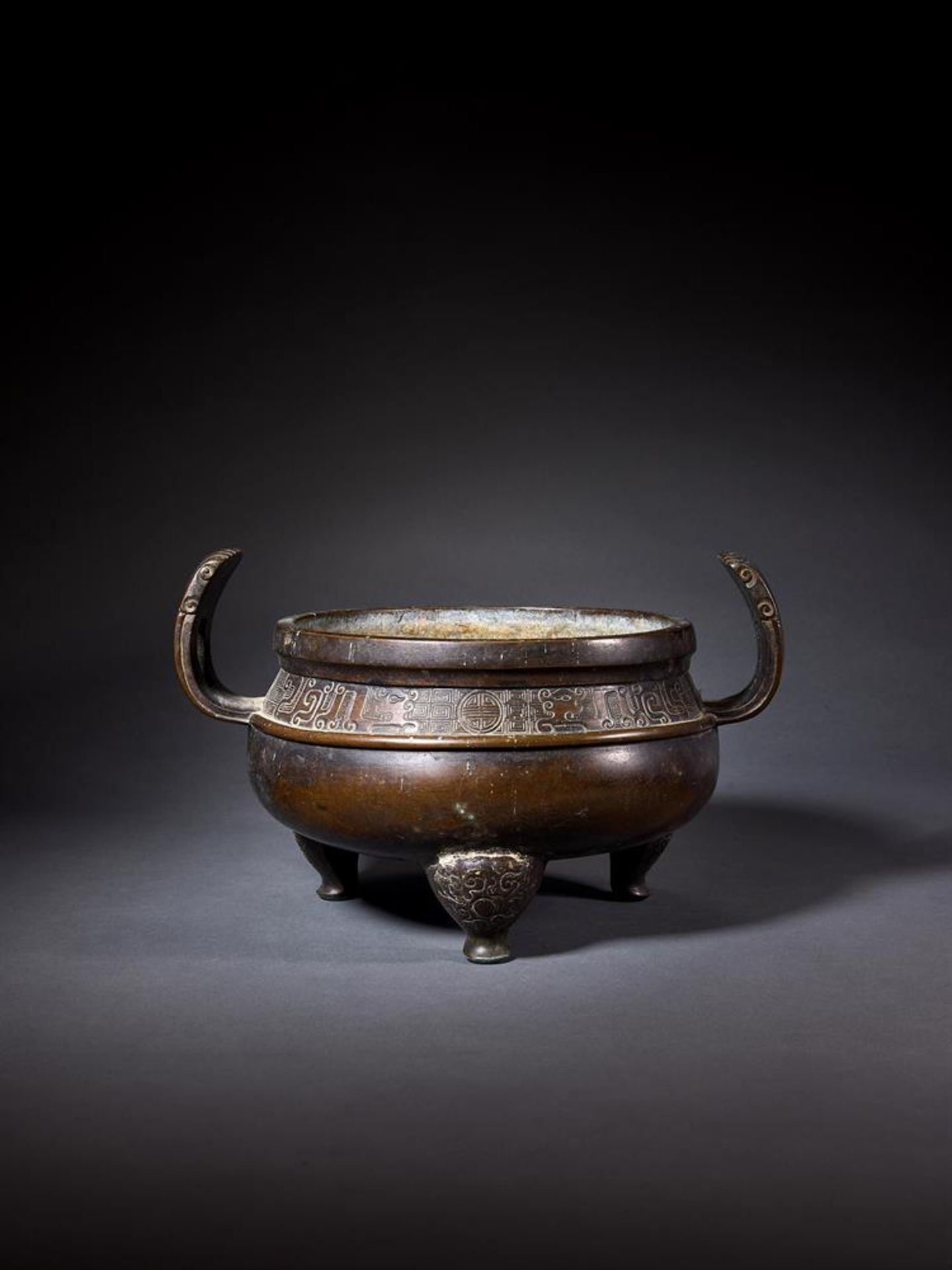 A CHINESE BRONZE TRIPOD CENSER, 17TH OR 18TH CENTURY