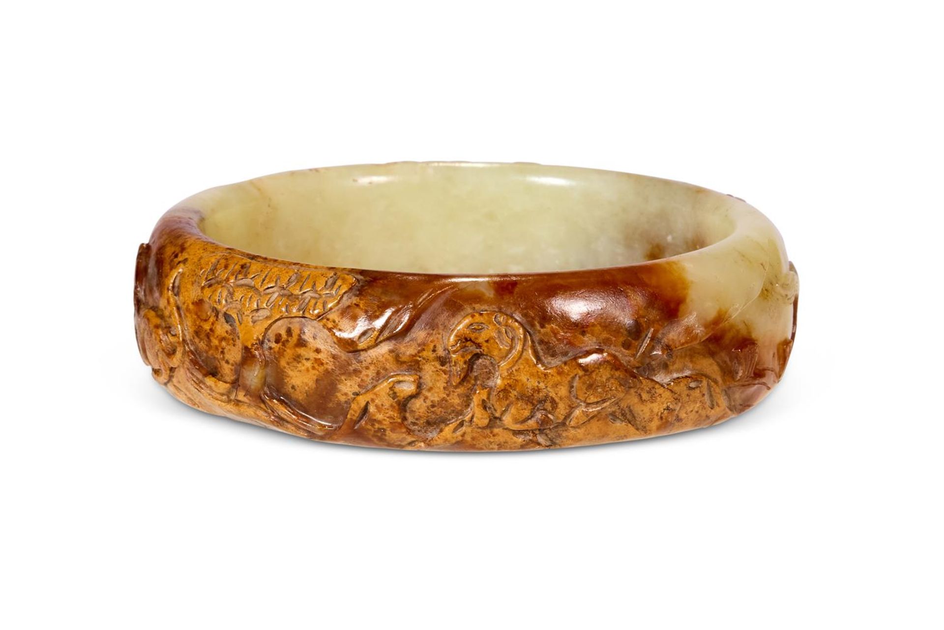 A CHINESE MOTTLED GREEN AND BROWN JADE BRACELET, QING DYNASTY (1644-1911)