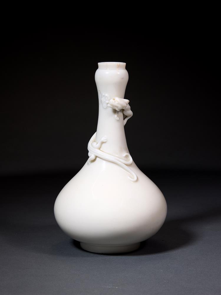 A CHINESE DEHUA 'DRAGON' BOTTLE VASE, QING DYNASTY