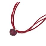 WEMPE, A RUBY AND DIAMOND SET HEART PENDANT