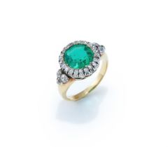 A LATE 19TH CENTURY EMERALD AND DIAMOND CLUSTER RING