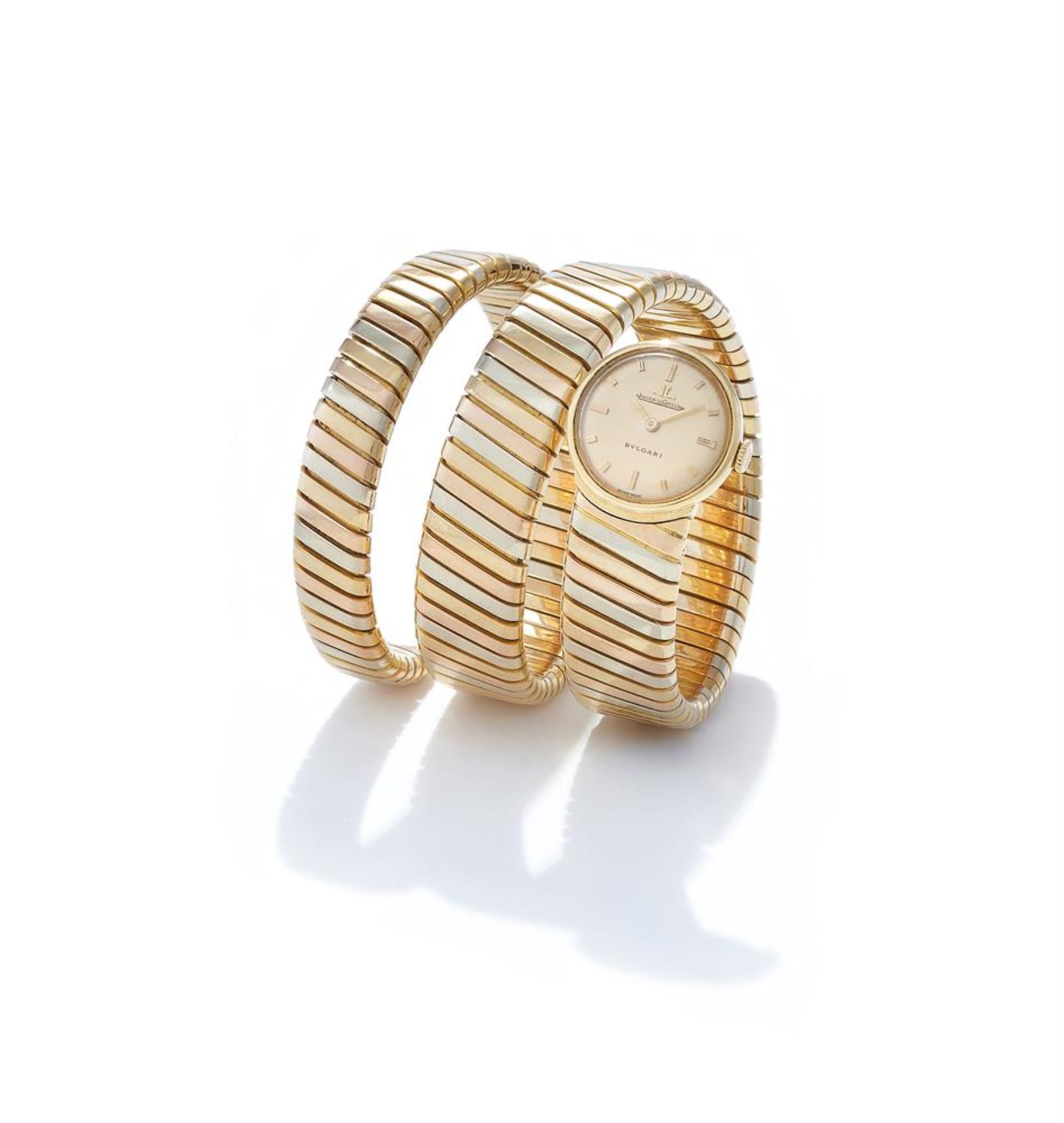 Ω BULGARI AND JAEGER-LECOULTRE, A TRI COLOURED 'TUBOGAS SERPENTI' BRACELET WATCH