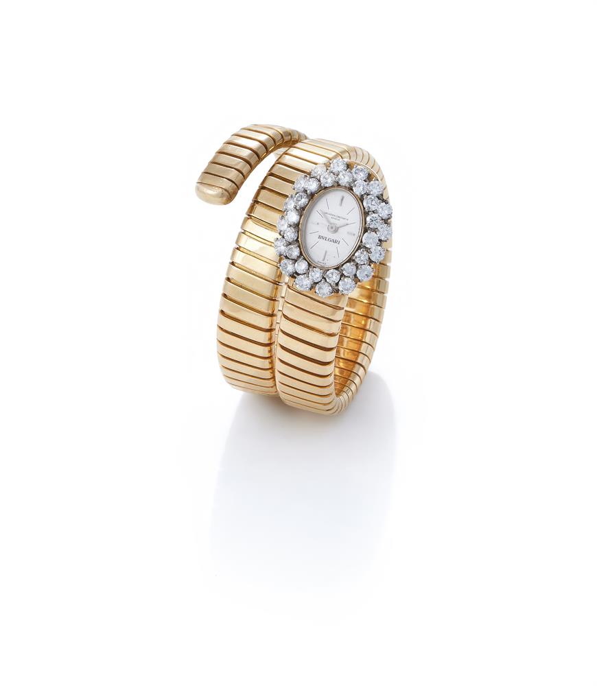 Ω BULGARI AND VACHERON CONSTANTIN, A DIAMOND SET 'TUBOGAS SERPENTI' BRACELET WATCH