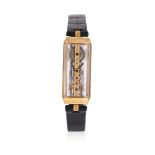 Y CORUM, GOLDEN BRIDGE, A LADY'S 18 CARAT GOLD AND SAPPHIRE CRYSTAL WRISTWATCH