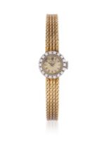 ROLEX, A LADY'S TWO TONE GOLD COLOURED AND DIAMOND BRACELET WATCH