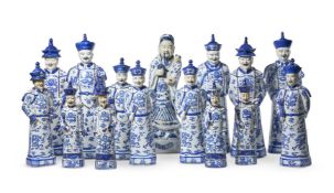 A GARNITURE OF FIFTEEN ASIAN BLUE AND WHITE MODELS OF IMPERIAL COURT OFFICIALS, MODERN