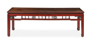 A CHINESE RED VARNISHED PINE LOW TABLE, 19TH CENTURY