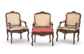 A SET OF THREE CARVED BEECH AND CANED FAUTEUILS IN LOUIS XV STYLE, BY MASSANT, 20TH CENTURY