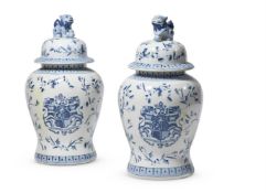 A PAIR OF ASIAN BLUE AND WHITE CRESTED BALUSTER JARS AND COVERS, MODERN
