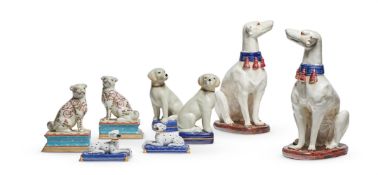 A PAIR OF ASIAN MODELS OF SEATED GREYHOUNDS, MODERN