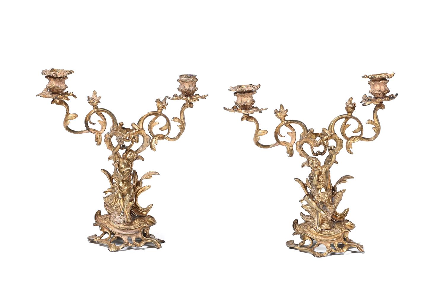 A PAIR OF FRENCH GILT METAL FIGURAL CANDLESTICKS