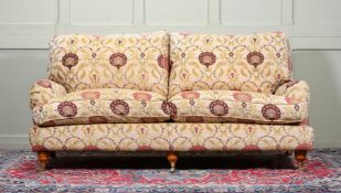 A SOFA IN THE STYLE OF HOWARD & SONS