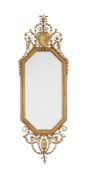 A LARGE CARVED GILTWOOD AND COMPOSITION MIRROR, IN GEORGE III STYLE
