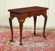 A GEORGE II MAHOGANY FOLDING TEA TABLE, CIRCA 1740
