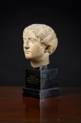 A ROMAN MARBLE PORTRAIT HEAD OF A WOMAN, 1ST-2ND CENTURY A.D