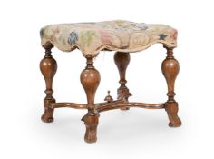 A WILLIAM & MARY WALNUT AND NEEDLEWORK UPHOLSTERED STOOL, CIRCA 1690