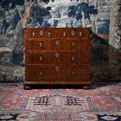 A QUEEN ANNE OLIVEWOOD OYSTER VENEERED AND WALNUT CROSSBANDED CHEST OF DRAWERS, CIRCA 1710
