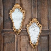 A PAIR OF GEORGE I CARVED GILTWOOD GIRANDOLE MIRRORS, CIRCA 1720