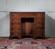 A WILLIAM & MARY WALNUT AND SEAWEED MARQUETRY KNEEHOLE DESK, IN THE MANNER OF GERRIT JENSEN