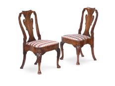 A PAIR OF GEORGE II CARVED WALNUT SIDE CHAIRS, CIRCA 1740