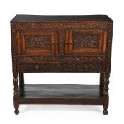 A CHARLES II CARVED OAK LIVERY CUPBOARD, CIRCA 1660