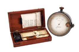A LATE VICTORIAN OXIDISED BRASS ANEROID SURVEYOR’S BAROMETER