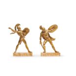 A PAIR OF GILT BRONZE BOOKENDS FORMED AS FIGURES OF GREEK WARRIORS