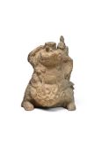 A CHINESE POTTERY FIGURE OF A MYTHICAL BEAST, TANG DYNASTY OR LATER