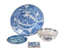 A GROUP OF FOUR TIN-GLAZED EARTHENWARE BLUE AND WHITE ITEMS, VARIOUS DATES 18TH CENTURY